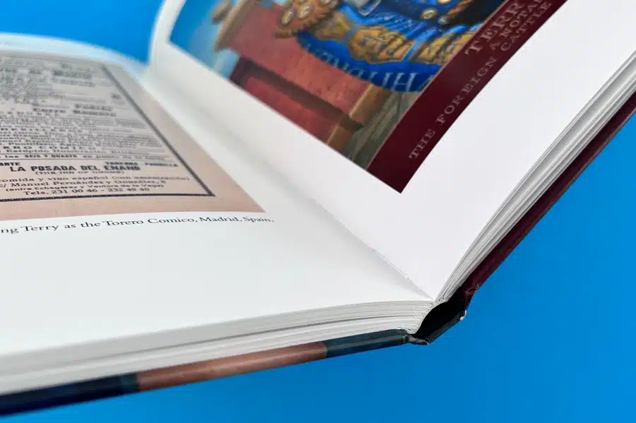 Close-up of section-sewn hardback photo book binding for durability.