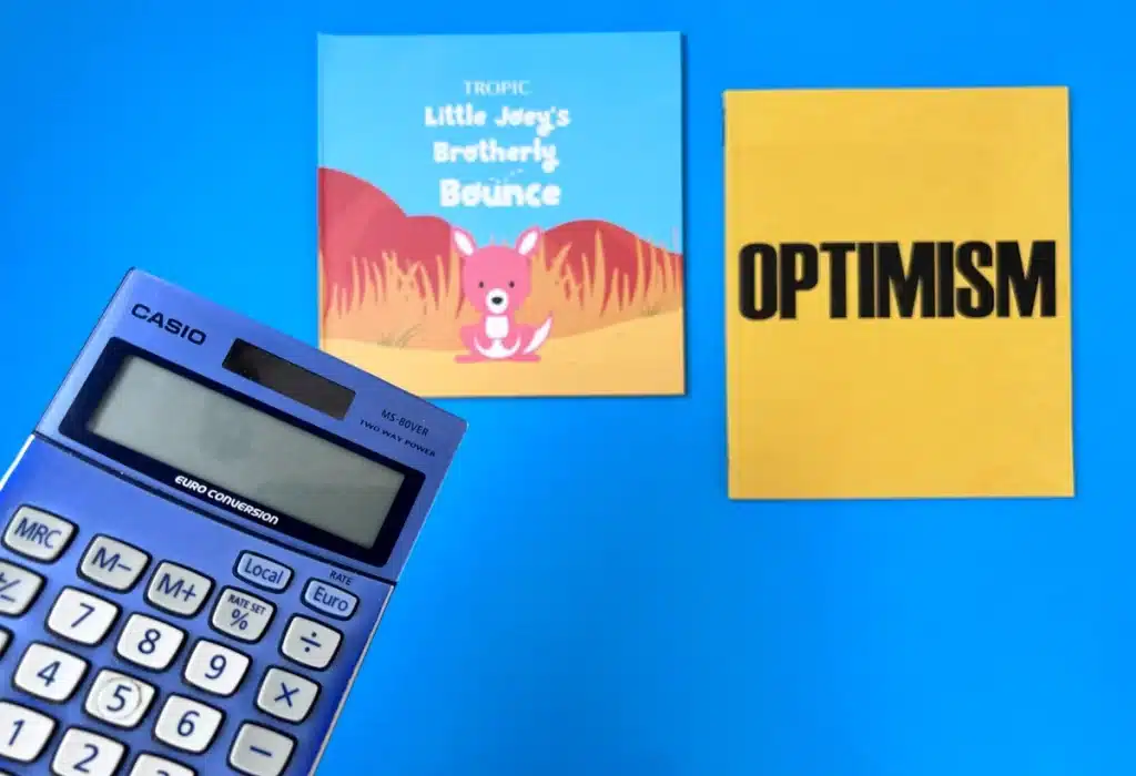 An image showing a set of books with a calculator