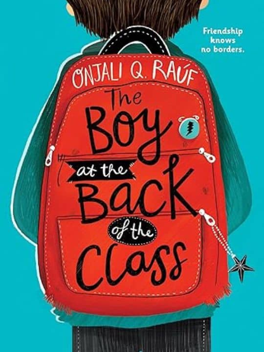 The Boy at the Back of the Class cover with red backpack against blue background.
