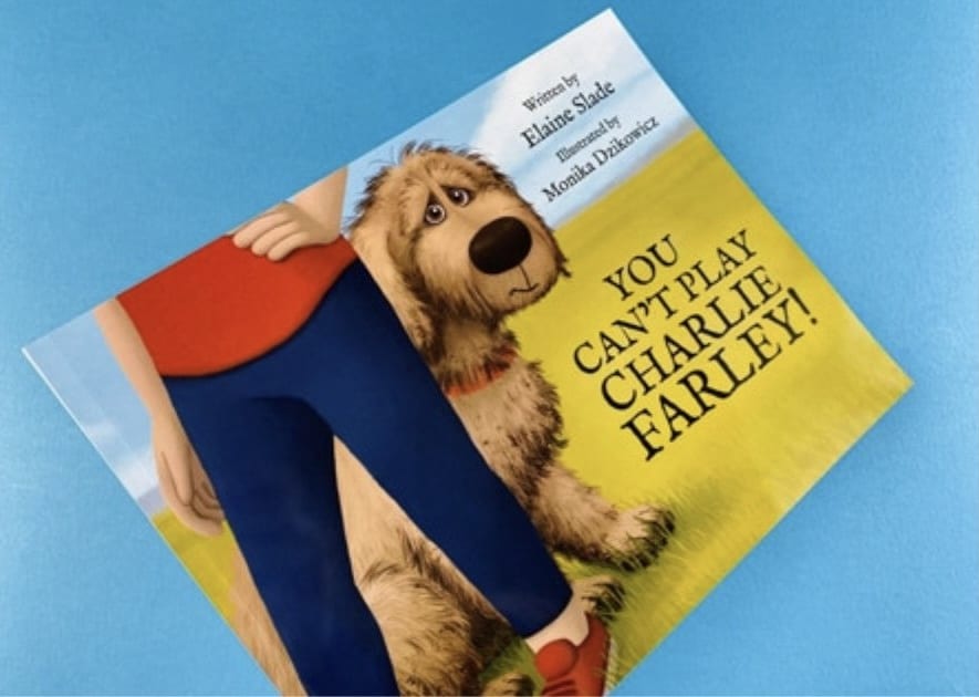 You Can’t Play, Charlie Farley cover with shy dog peeking from behind owner’s legs.