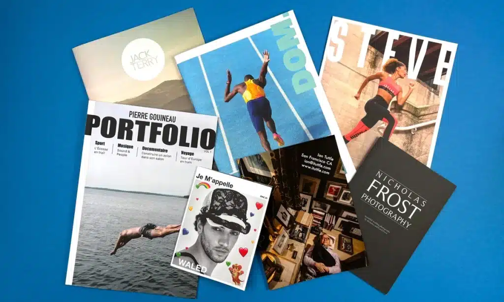 A high-end photo portfolio book displayed on a wooden desk with a sleek, minimalist design.