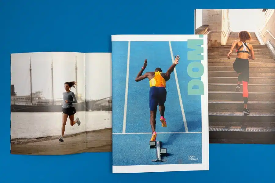 A photographer showcasing their portfolio to a potential client in a meeting
