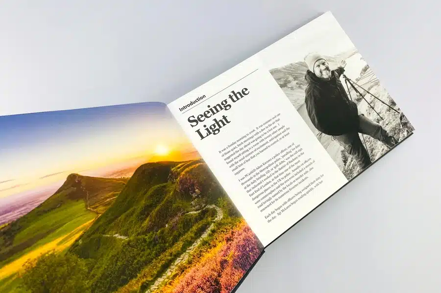 A person choosing fonts and colors for a photo book layout
