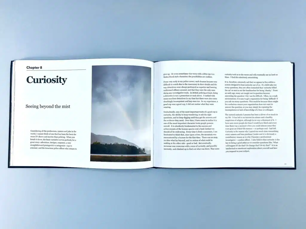 Photo Book Chapter on Curiosity with a Rainbow Over Mountains