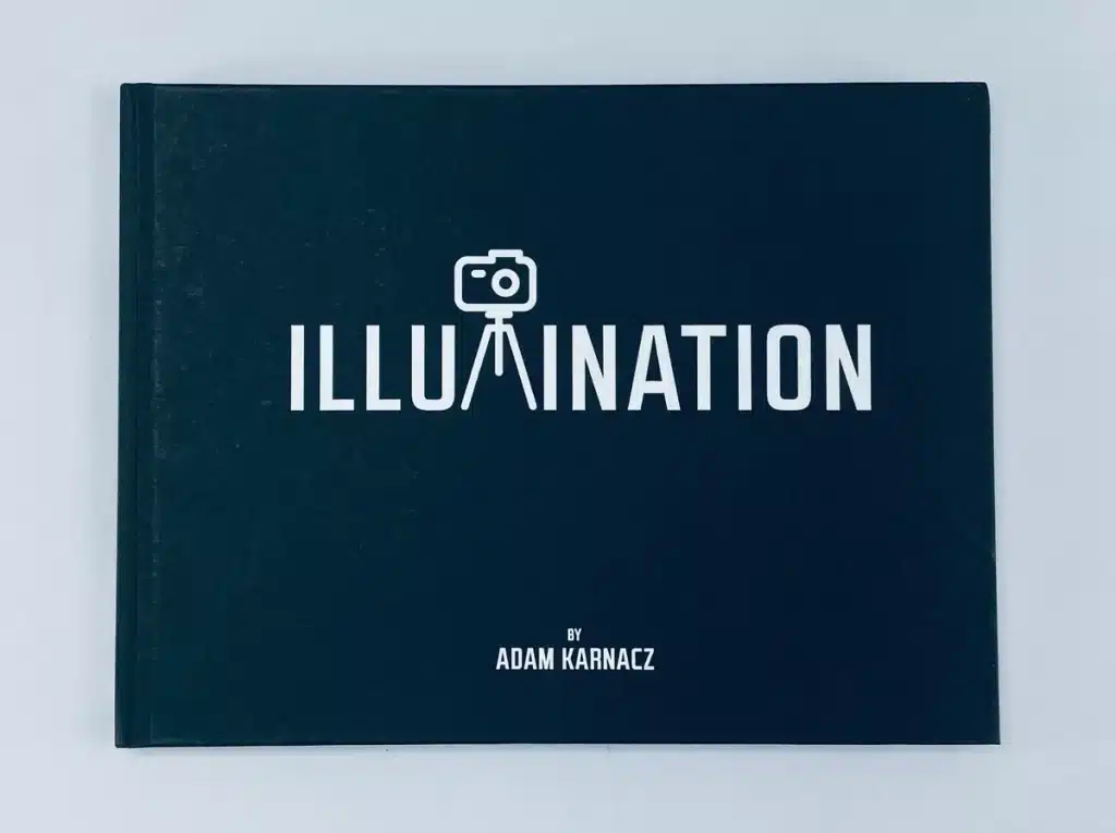 Front cover of Illumination, featuring a white foiled title on a black Wibalin Natural cover.