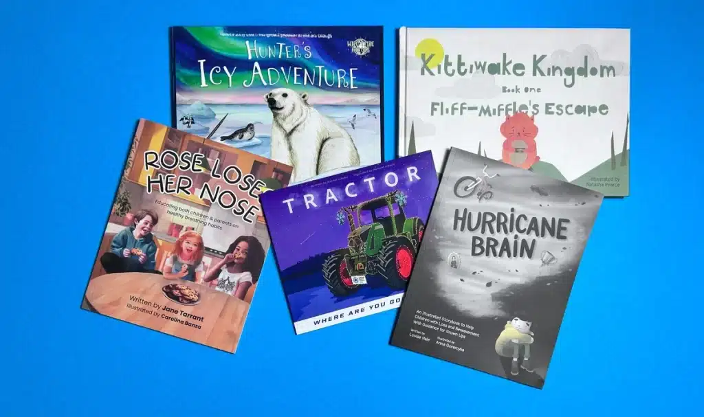 Author reviewing proof copies while self publishing a children’s book
