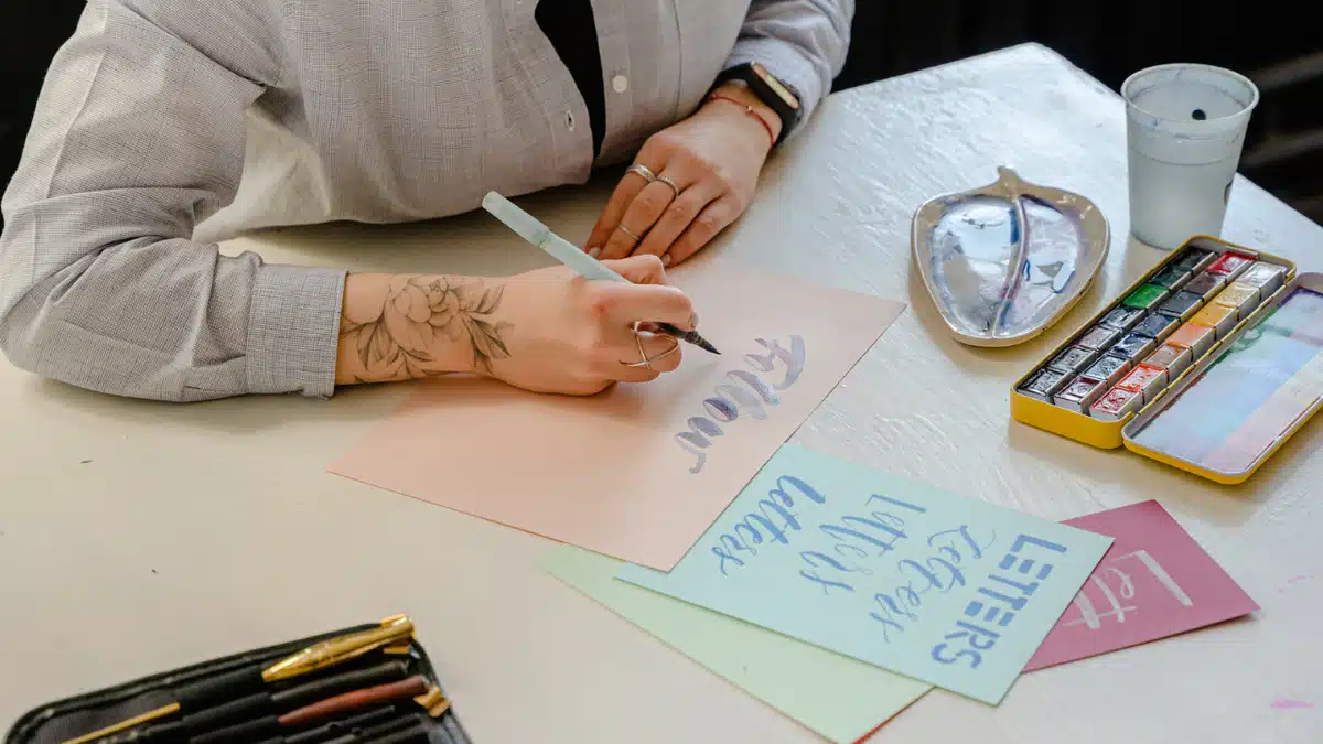 Person creating letter fonts
