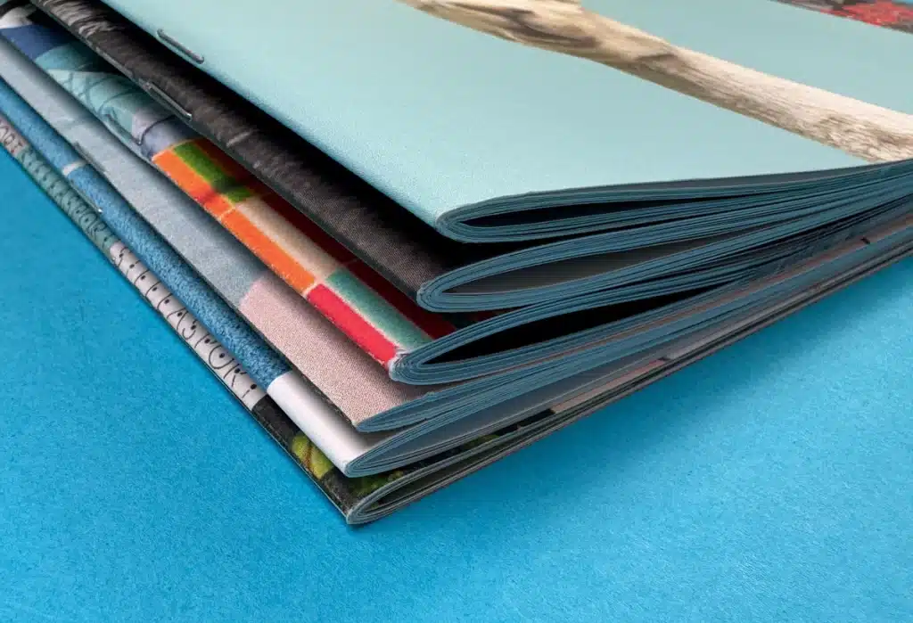 Staple-bound booklet with a folded, professional spine