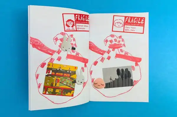An artist exploring a collection of comic books printed at Ex Why Zed for research and inspiration