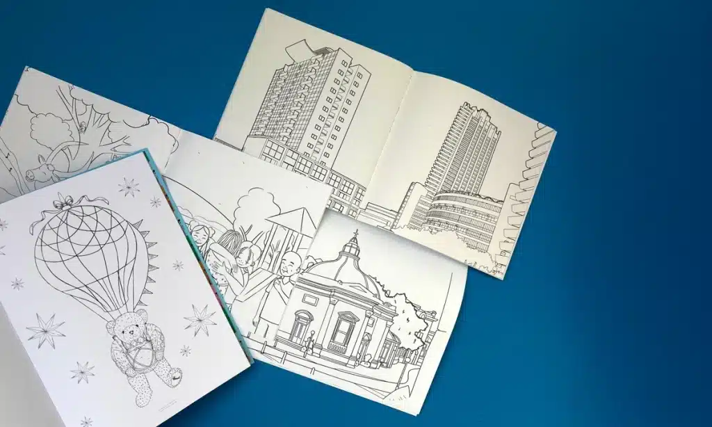 A beautifully printed coloring book with intricate designs, professionally printed by Ex Why Zed.