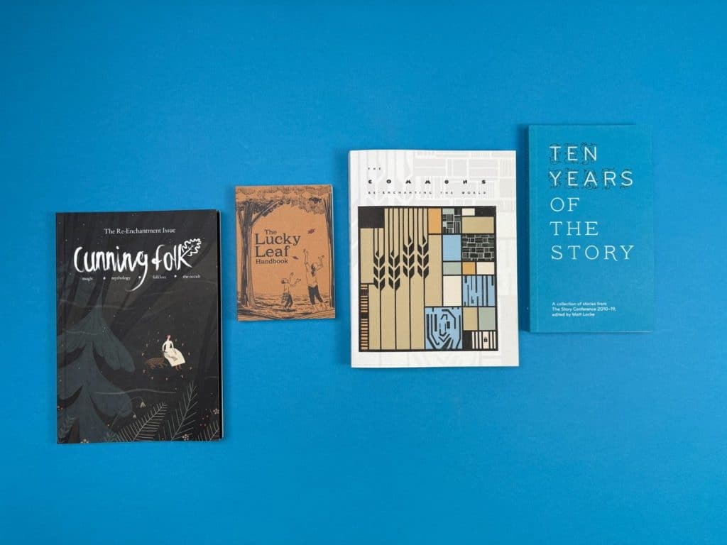 Poetry book cover with nature-inspired artwork including flowers, trees, and stars, printed at Ex Why Zed.