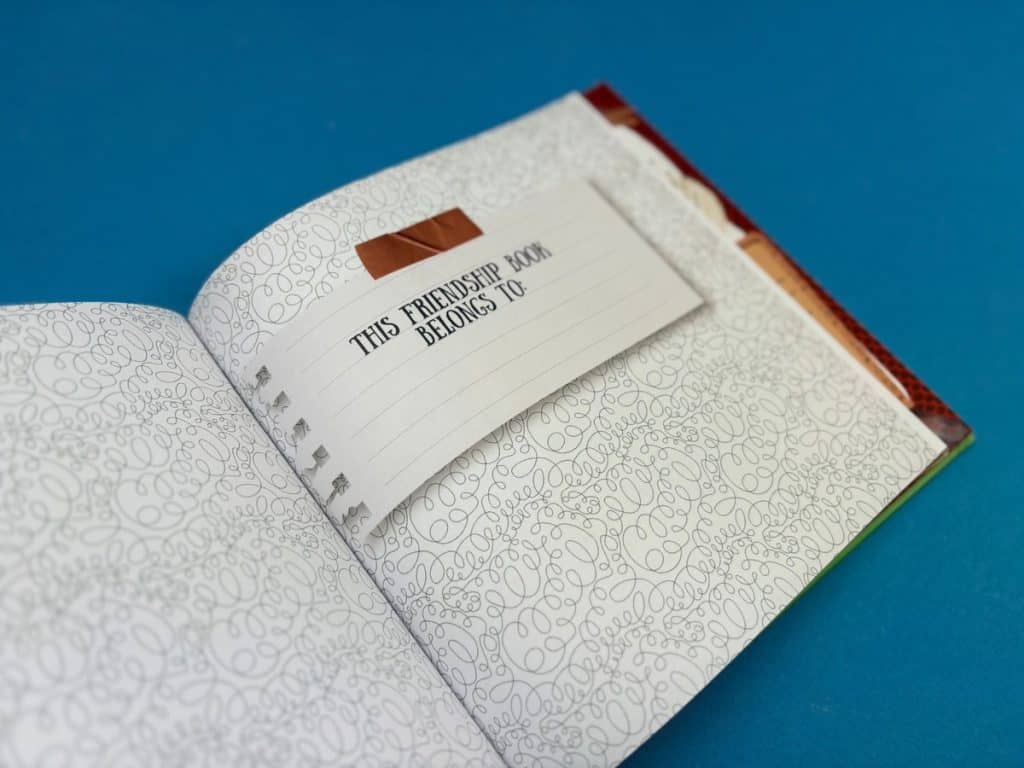 Designer checking custom journal proof before print run.