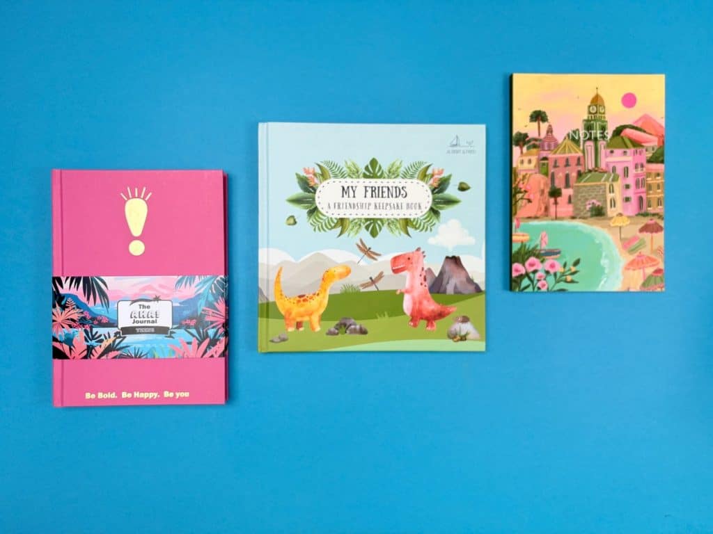 Hero image of custom printed journals with gold foiling and premium finishes.