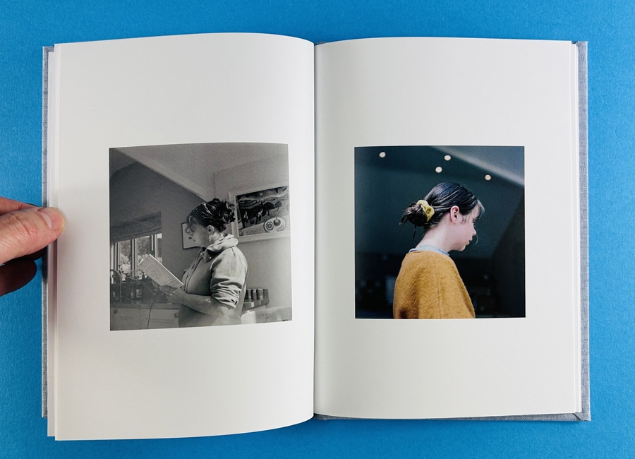 Family flipping through a custom printed photo book of memories