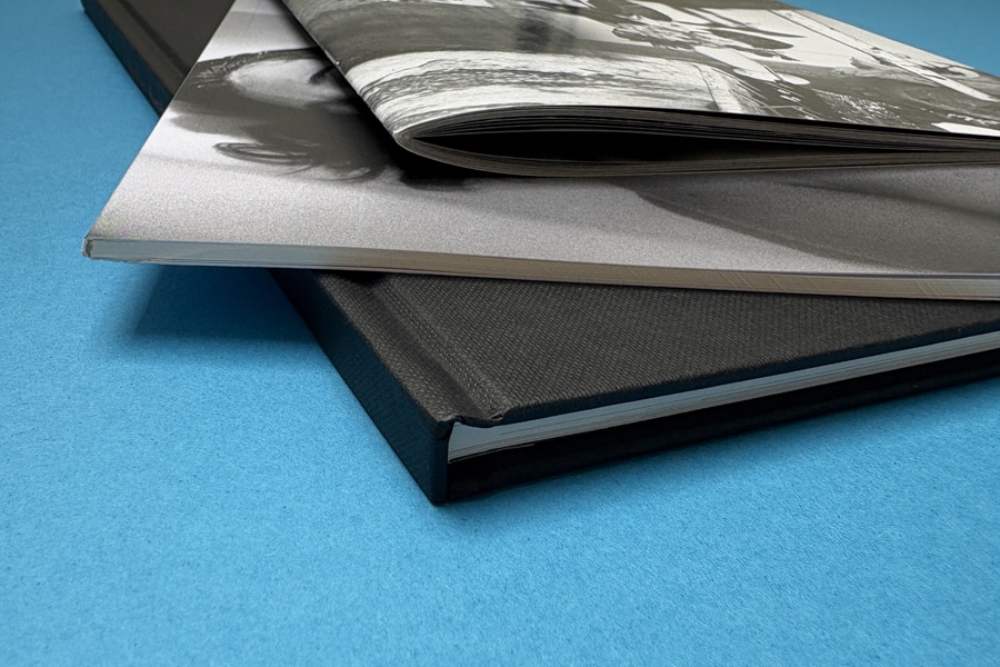 Hardcover versus softcover photo book comparison with durability and design features