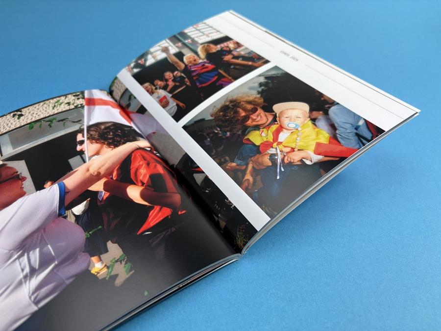 Photobook opened to a collage layout showing multiple portrait and landscape images