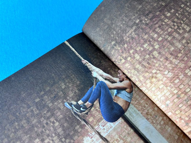 Tight spine gutter on a paperback book highlighting reduced flexibility