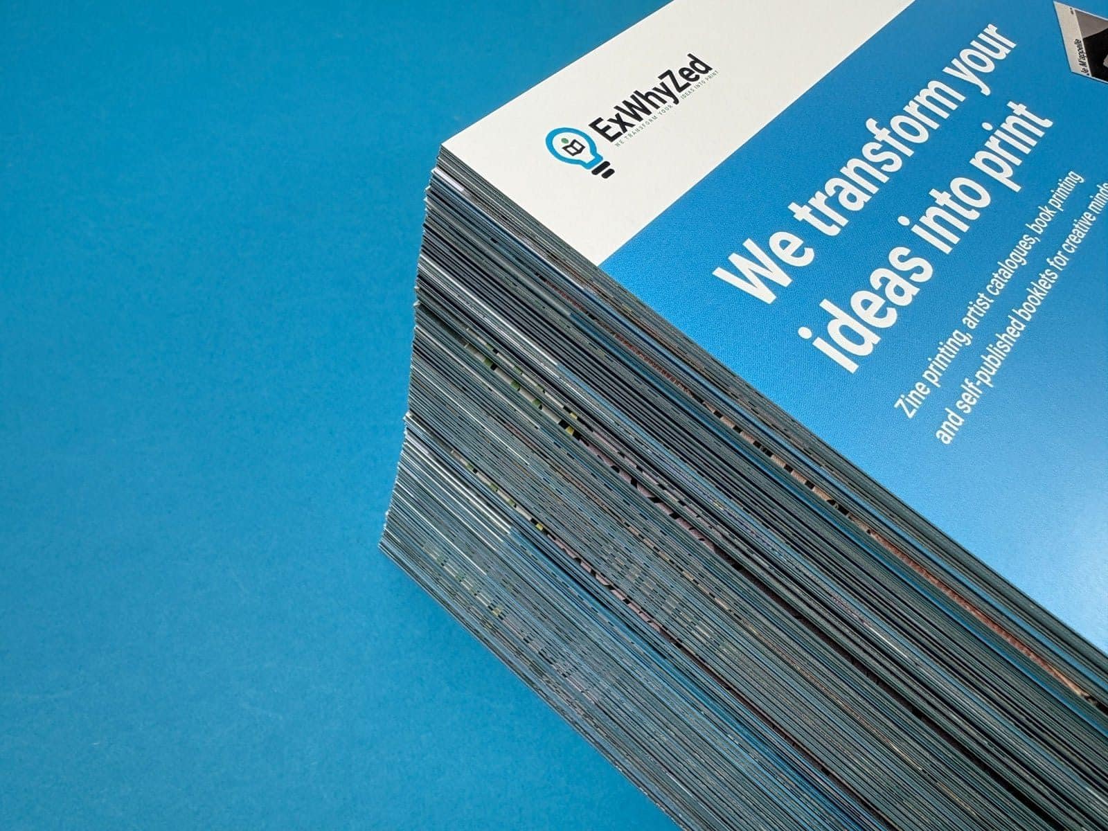 Examples of zine paper types including matte, glossy, and recycled options for printing