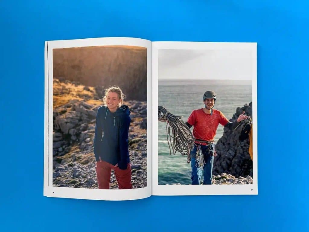 Open photo book showing two full-page photo prints on a bright blue background