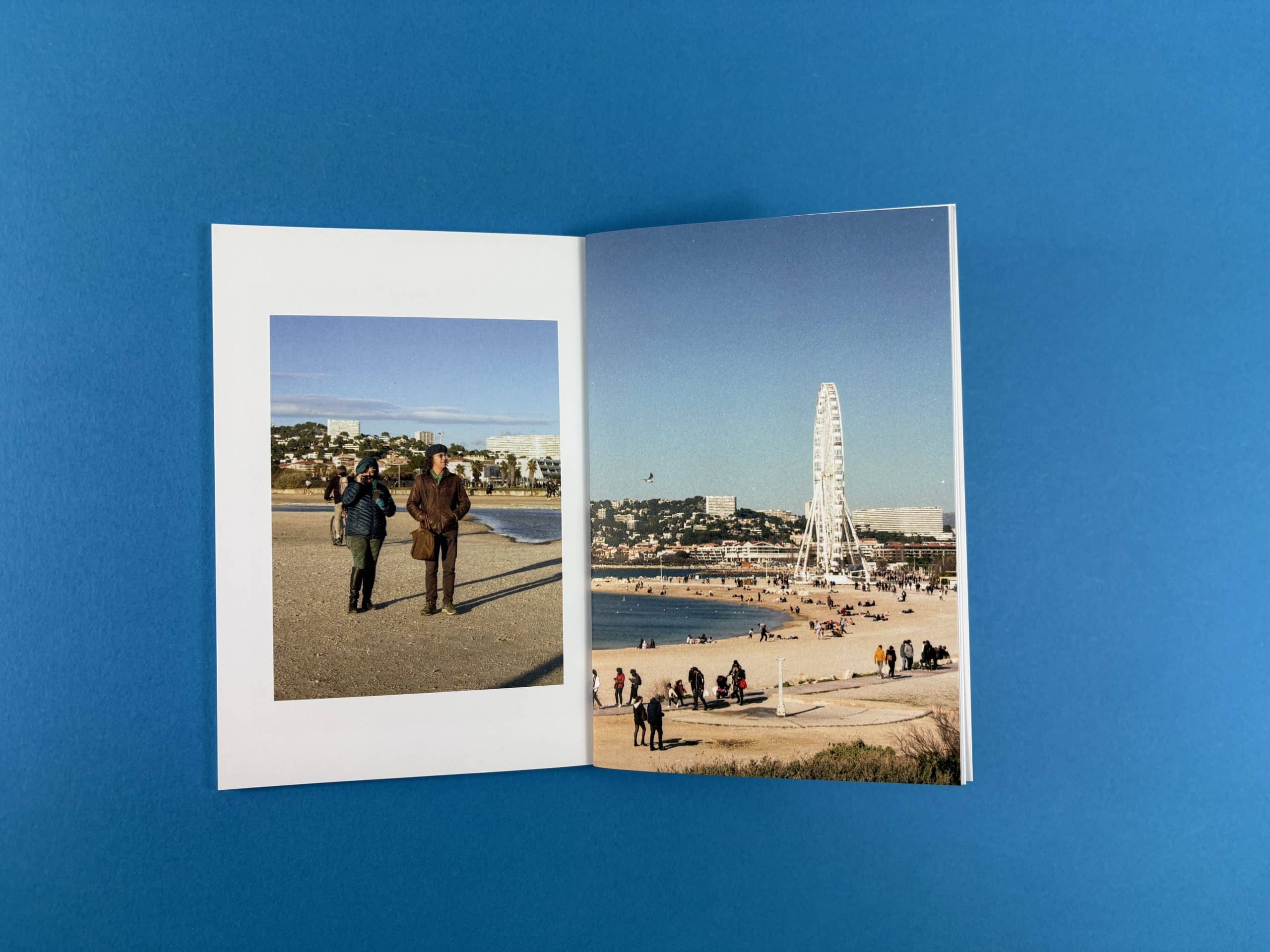 Open spread from Marseille by Ben Scrimgeour showing the seafront and a ferris wheel