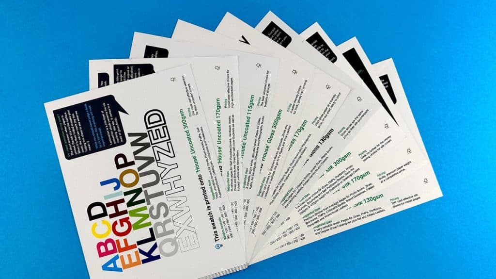 Ex Why Zed paper swatch cards showing different paper types and GSM weights on a blue background.