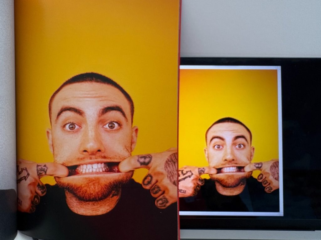 Printed photo book spread beside its brighter on-screen preview, showing colour shift from screen to print.