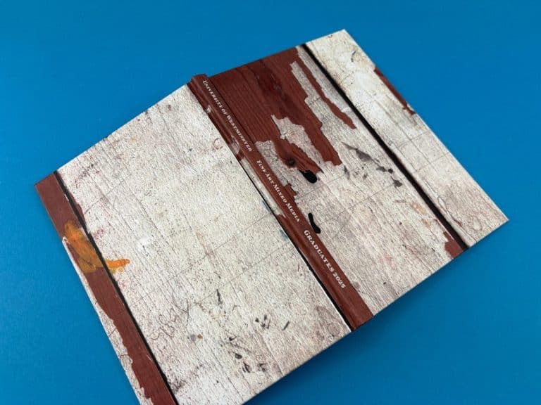 A5 hardback degree show catalogue cover with full-bleed artwork, printed by Ex Why Zed.