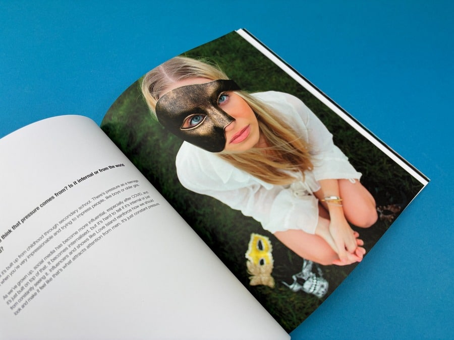 Open creative magazine showing a full-page portrait photograph beside a clean editorial text layout.