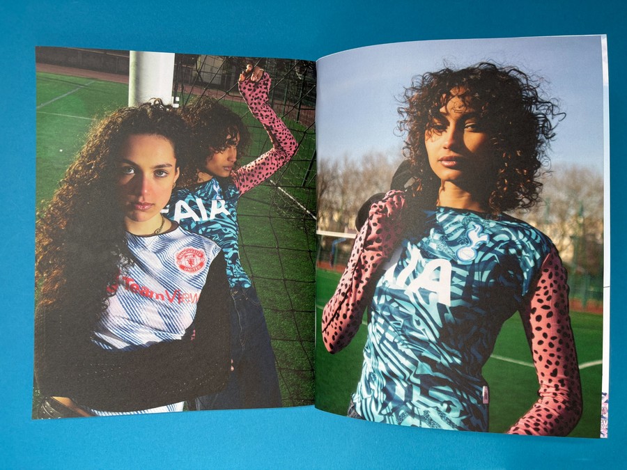 Open glossy football magazine spread showing full-bleed photography on bright coated paper.