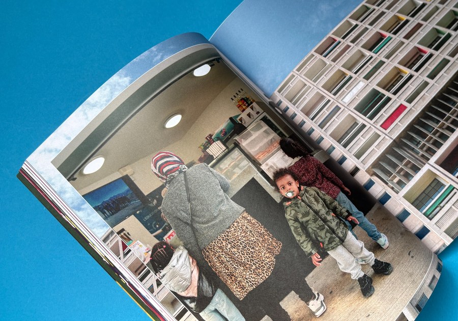 Open colour brochure showing full-page photography, clean margins and rich print reproduction.