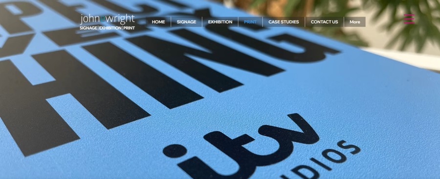 John E Wright website header showing a close-up print background and navigation for print services.