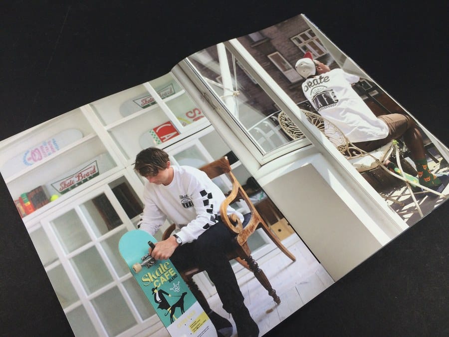 An open zine showing a busy, image led layout, the sort of page count and design that affects zine printing costs in Leeds.
