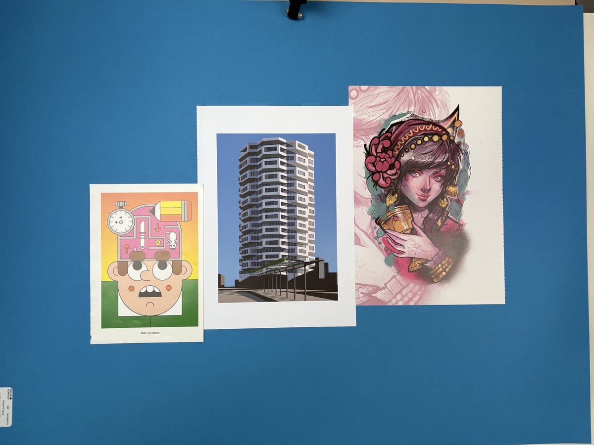Three art prints in different sizes displayed together on a wall, showing how A4, A3 and A2 formats compare in scale and visual impact.