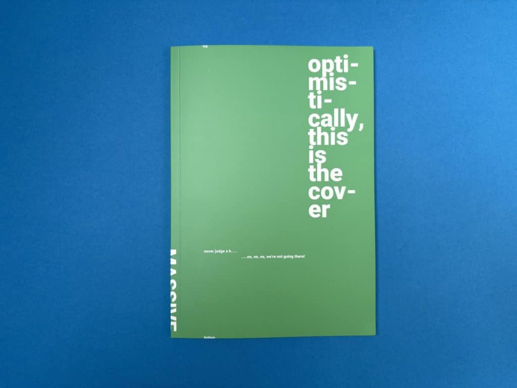 The Ex Why Zed printed paper sample book on a blue background, used to compare silk, gloss, matte, uncoated and recycled stocks before printing.