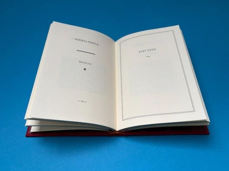 An open black-and-white book interior printed by Ex Why Zed, the most cost-effective option for text-focused publications.