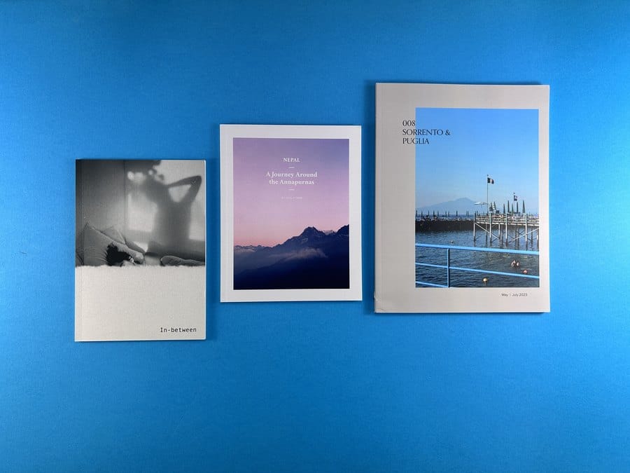 Self-published photo books and paperbacks in different trim sizes, showing how book type shapes format, paper and binding choices.