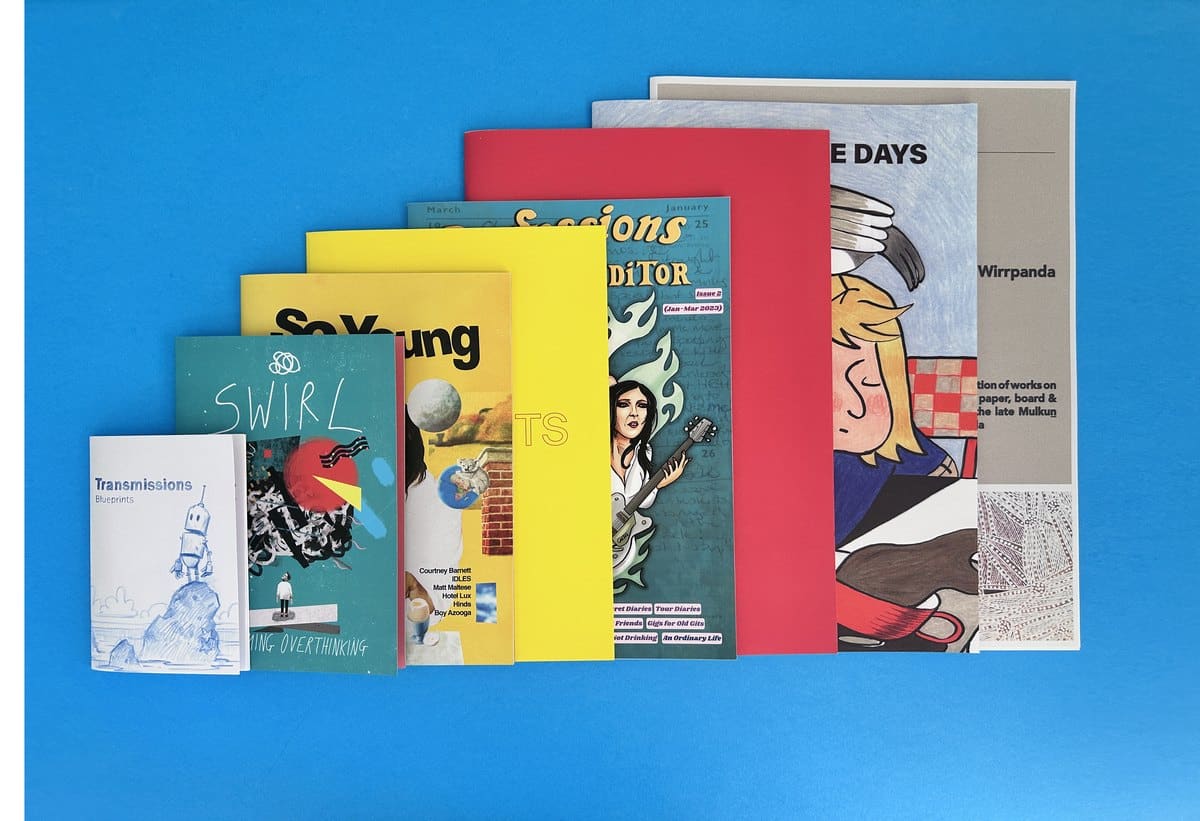Printed booklets fanned out in a range of sizes and page counts, showing how format and specification drive booklet printing costs in the UK.