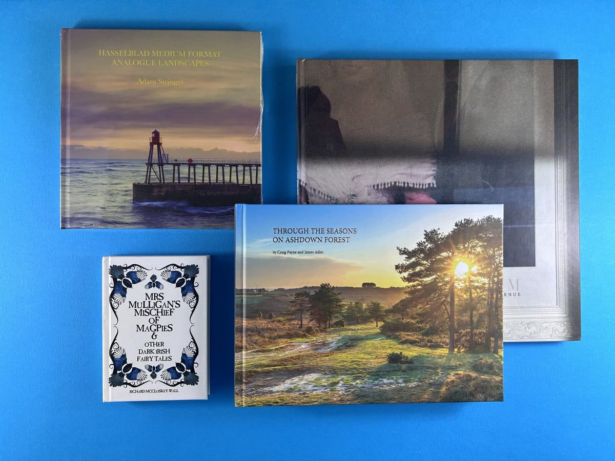 Hardback and paperback books printed by Ex Why Zed in different formats and page counts, the specifications that decide what a book costs to print.