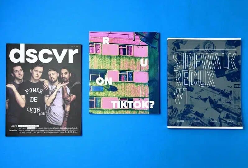 Three professionally printed magazines displayed against a blue background, showing different formats and print finishes used in UK magazine printing