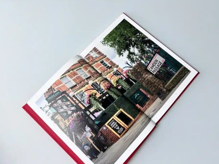An open book printed by Ex Why Zed showing a full-colour illustrated spread, the kind of result a proof check protects.