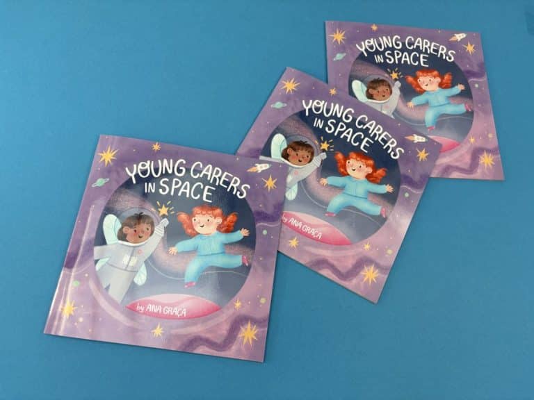 Free picture books for young carers spread across a desk, each square cover framed by a round porthole