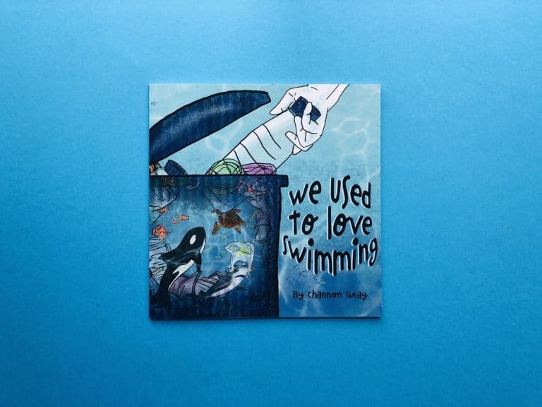 Square children’s picture book cover for We Used To Love Swimming, showing a sea-filled bin with an orca and turtle inside.